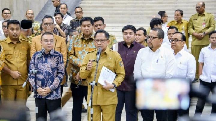 Ilustrasi sinergi pemerintah pusat dan daerah dalam percepatan pembangunan dan pemulihan ekonomi regional.