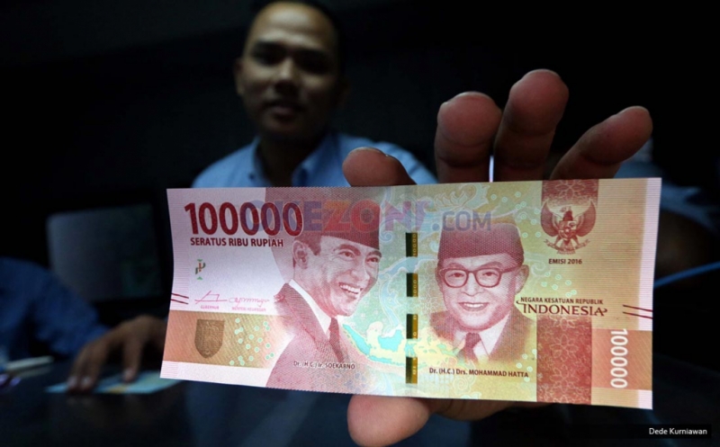 Ilustrasi mata uang Rupiah yang terus mengalami tekanan di tengah gejolak global.