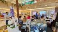 Suasana interaktif di sebuah pameran produk inovatif, merefleksikan semangat Expo Wellness, Home & Living QNET Indonesia 2026.
