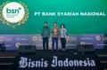 Wakil Direktur Utama PT Bank Syariah Nasional (Bank BSN) Arga M. Nugraha (tengah) berfoto bersama Penanggung Jawab Redaksi/Managing Director Bisnis Indonesia Group Hery Trianto (kiri) dan Komisaris Bisnis Indonesia Group Lulu Terianto (kanan) usai menerima penghargaan Champion of Growth pada Bisnis Indonesia Financial Awards (BIFA) 2026.
