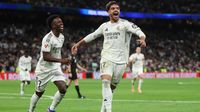 Vinicius Junior berlatih keras di tengah tekanan performa, didukung penuh rekan setimnya Raul Asensio di Real Madrid.